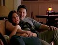 Matt and Janice sit together in their living room.