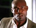 The Haitian struggles to block Arthur Petrelli's massive power. (Our Father)