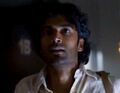 After forcing the door, Mohinder enters the apartment.