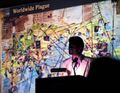 Mohinder lectures in Cairo in front of another version of the map.