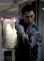 Ando knocks out Linderman's curator with a gun.