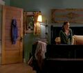 In her bedroom, Janice contemplates her marriage to Matt.