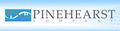 In the logo for Pinehearst Company.