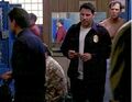 Matt and Tom McHenry talk in the precinct's locker room.