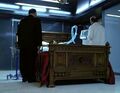 A doctor looks on as Maury speaks with Arthur in a medical room in the Pinehearst building.