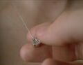 Sylar "reads" Claire's heart necklace. (An Invisible Thread)